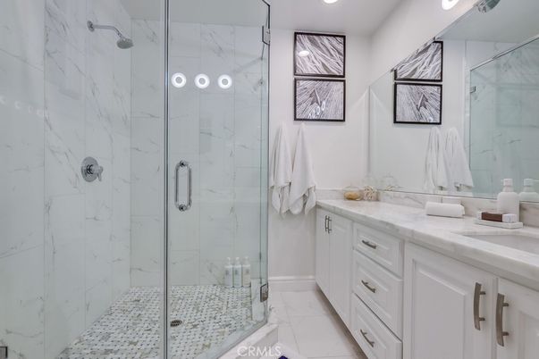 Bathroom, Dual Sink Vanities, Glass Shower, Interior, Marble, Marble Walls, Recessed Lighting
