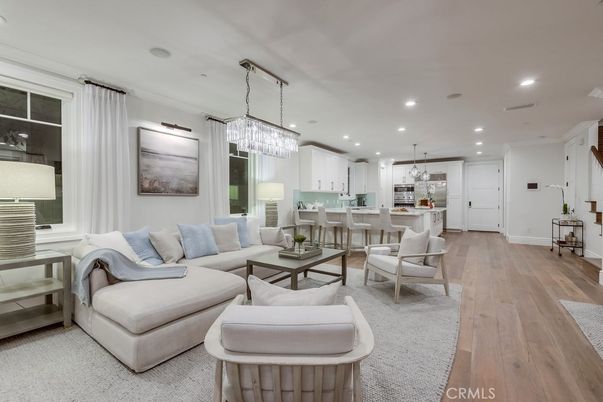 Chandelier, Dining room, Interior, Kitchen, Living room, Pendant Lights, Recessed Lighting, Stainless Steel Appliances, Wood Texture Flooring