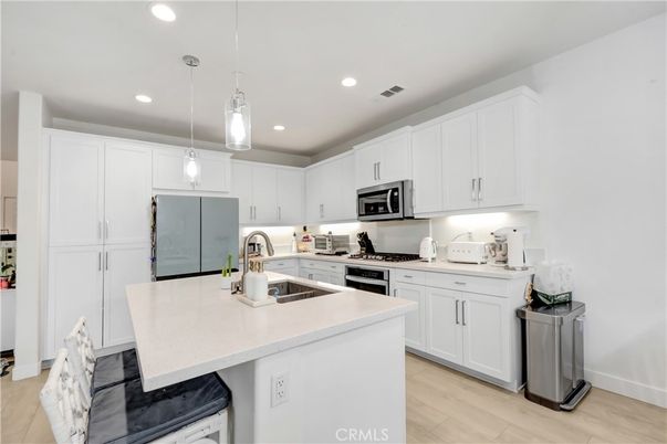 Interior, Kitchen, Pendant Lights, Recessed Lighting, Stainless Steel Appliances, Wood Texture Flooring
