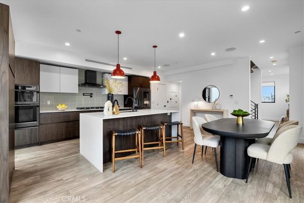 Dining room, Interior, Kitchen, Pendant Lights, Recessed Lighting, Stainless Steel Appliances, Wood Texture Flooring