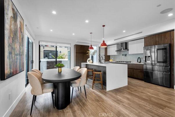 Dining room, Interior, Kitchen, Pendant Lights, Recessed Lighting, Stainless Steel Appliances, Wood Texture Flooring