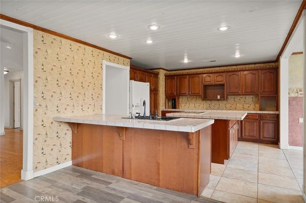Interior, Kitchen, Recessed Lighting, Tile Countertops, Wood Texture Flooring