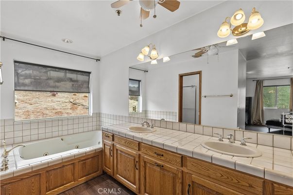 Bathroom, Dual Sink Vanities, Interior, Recessed Lighting, Tile Countertops, Wood Texture Flooring