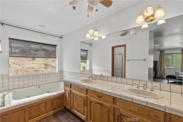 Bathroom, Dual Sink Vanities, Interior, Recessed Lighting, Tile Countertops, Wood Texture Flooring