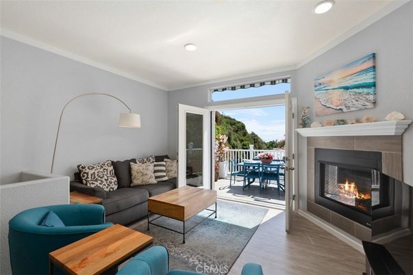 Dining room, Fireplace, Interior, Living room, Recessed Lighting, Wood Texture Flooring