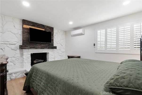 Bedroom, Fireplace, Interior, Recessed Lighting, Wood Texture Flooring