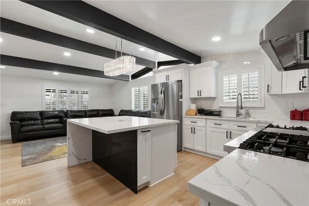 Chandelier, Interior, Kitchen, Living room, Pendant Lights, Recessed Lighting, Stainless Steel Appliances, Wood Texture Flooring