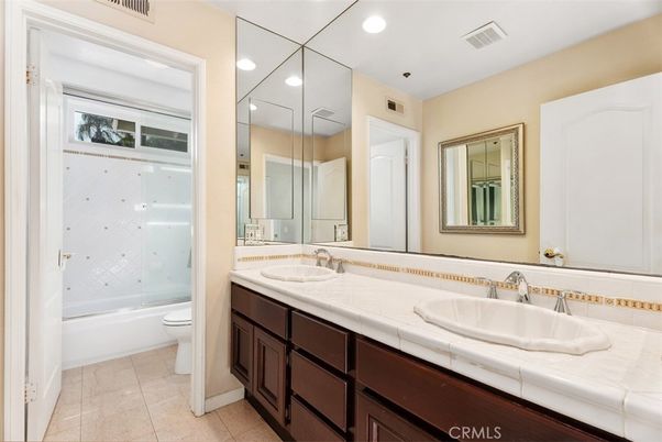 Bathroom, Dual Sink Vanities, Glass Shower, Interior, Recessed Lighting, Tile Countertops