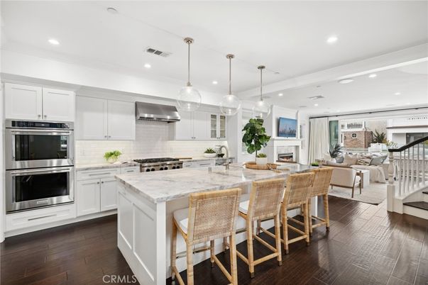 Dining room, Fireplace, Interior, Kitchen, Living room, Pendant Lights, Recessed Lighting, Stainless Steel Appliances, Wood Texture Flooring