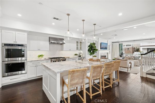 Dining room, Fireplace, Interior, Kitchen, Living room, Pendant Lights, Recessed Lighting, Stainless Steel Appliances, Wood Texture Flooring