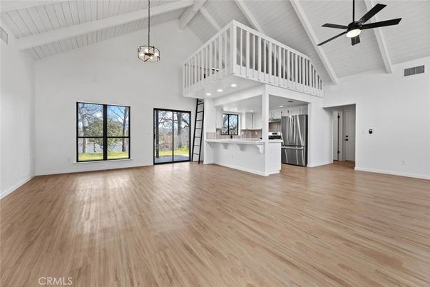 Empty room, Interior, Kitchen, Pendant Lights, Stainless Steel Appliances, Wood Texture Flooring