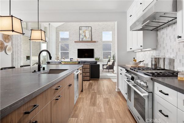 Fireplace, Interior, Kitchen, Living room, Pendant Lights, Stainless Steel Appliances, Stone Walls, Wood Texture Flooring