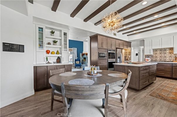Chandelier, Dining room, Interior, Kitchen, Pendant Lights, Recessed Lighting, Stainless Steel Appliances, Wooden Beams, Wood Texture Flooring