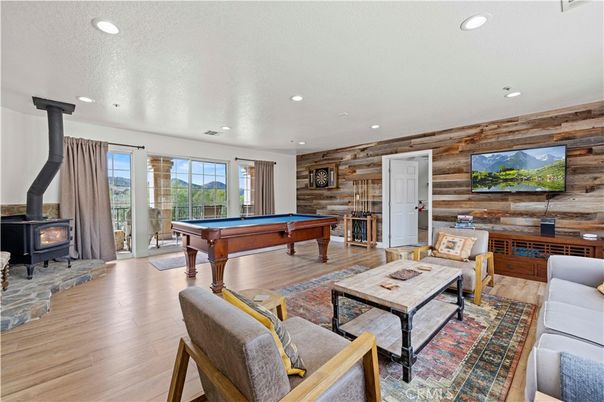 Billiard Table, Fireplace, Game Room, Interior, Living room, Recessed Lighting, Wood Texture Flooring, Wooden Walls