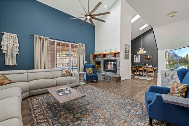 Dining room, Fireplace, Interior, Living room, Recessed Lighting, Wood Texture Flooring