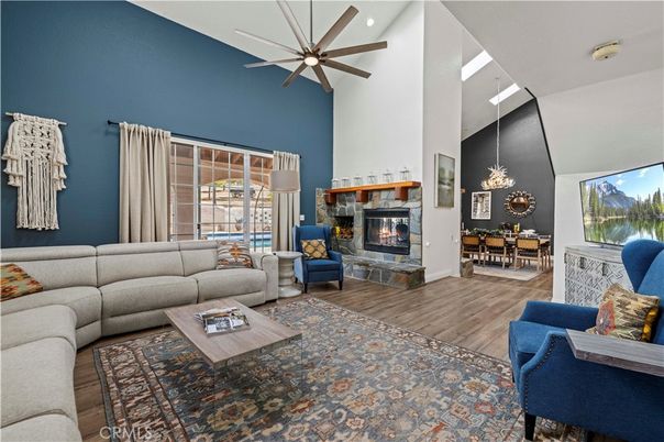 Dining room, Fireplace, Interior, Living room, Recessed Lighting, Wood Texture Flooring
