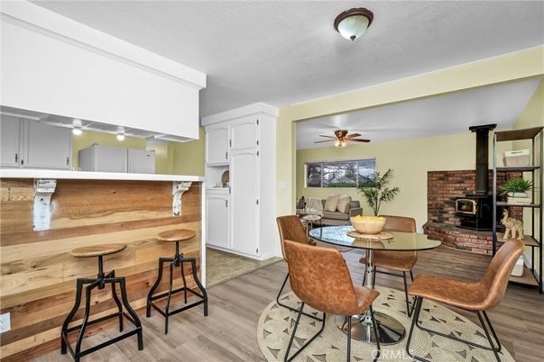 Dining room, Fireplace, Interior, Stone Walls, Wood Texture Flooring