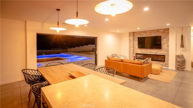 Dining room, Fireplace, Interior, Living room, Pendant Lights, Pool, Recessed Lighting, Stone Walls
