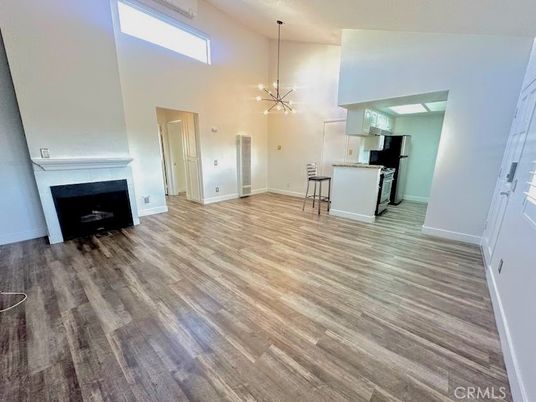 Empty room, Fireplace, Interior, Kitchen, Pendant Lights, Wood Texture Flooring