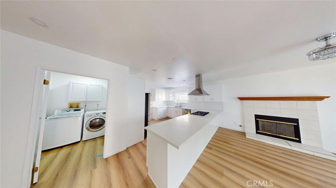 Fireplace, Interior, Kitchen, Recessed Lighting, Washer, Wood Texture Flooring
