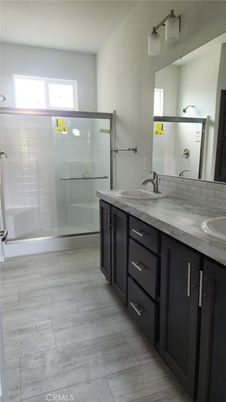 Bathroom, Dual Sink Vanities, Glass Shower, Interior, Wood Texture Flooring