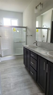 Bathroom, Dual Sink Vanities, Glass Shower, Interior, Wood Texture Flooring
