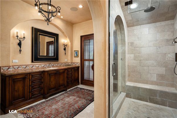 Bathroom, Dual Sink Vanities, Glass Shower, Interior, Recessed Lighting, Stone Walls