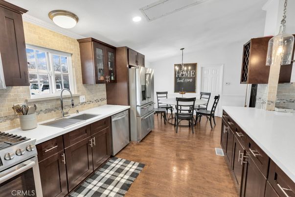 Dining room, Interior, Kitchen, Pendant Lights, Recessed Lighting, Stainless Steel Appliances, Wood Texture Flooring