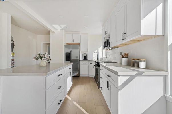 Interior, Kitchen, Recessed Lighting, Stainless Steel Appliances, Wood Texture Flooring