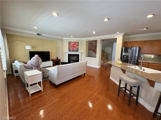 Fireplace, Interior, Kitchen, Living room, Recessed Lighting, Stainless Steel Appliances, Wood Texture Flooring