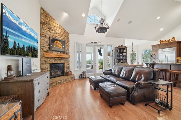 Chandelier, Dining room, Fireplace, Interior, Kitchen, Living room, Pendant Lights, Recessed Lighting, Stone Walls, Wood Texture Flooring