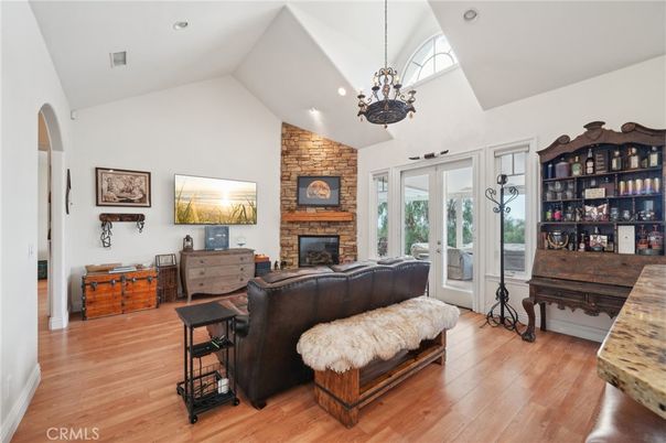 Fireplace, Interior, Living room, Pendant Lights, Recessed Lighting, Stone Walls, Wood Texture Flooring