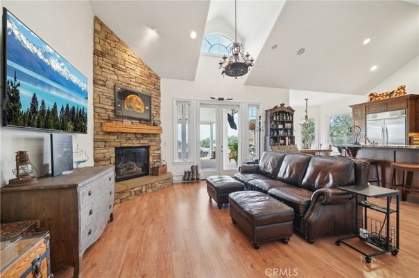 Fireplace, Interior, Living room, Pendant Lights, Recessed Lighting, Stone Walls, Wood Texture Flooring