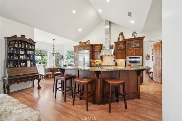 Chandelier, Dining room, Interior, Kitchen, Recessed Lighting, Stainless Steel Appliances, Wood Texture Flooring