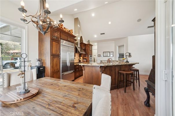 Chandelier, Dining room, Interior, Kitchen, Recessed Lighting, Stainless Steel Appliances, Wood Texture Flooring