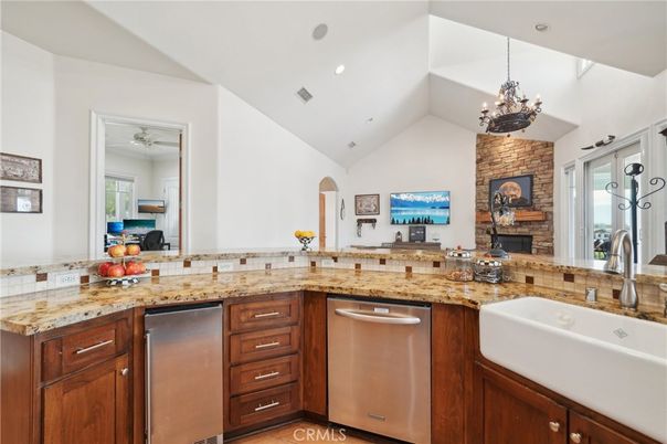 Fireplace, Interior, Kitchen, Recessed Lighting, Stainless Steel Appliances, Stone Walls