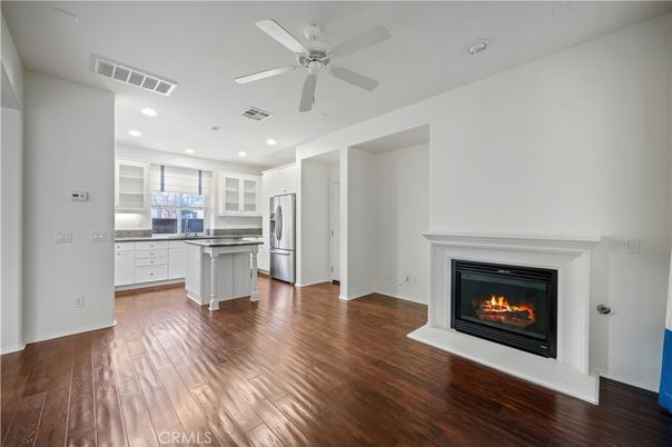 Empty room, Fireplace, Interior, Kitchen, Recessed Lighting, Wood Texture Flooring