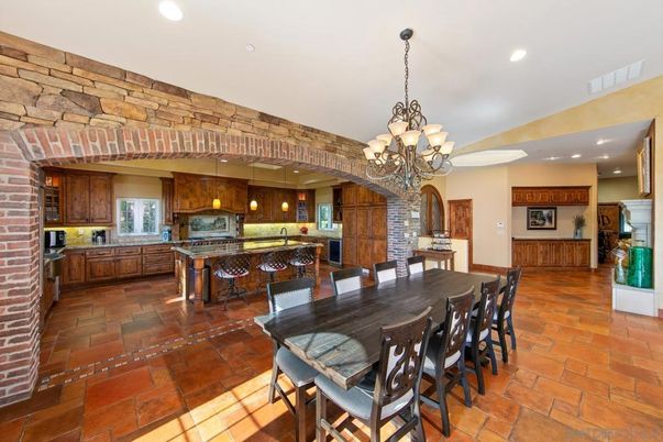 Chandelier, Dining room, Interior, Kitchen, Pendant Lights, Recessed Lighting, Stainless Steel Appliances, Stone Walls