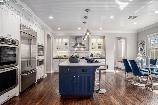 Dining room, Interior, Kitchen, Pendant Lights, Recessed Lighting, Stainless Steel Appliances, Wood Texture Flooring