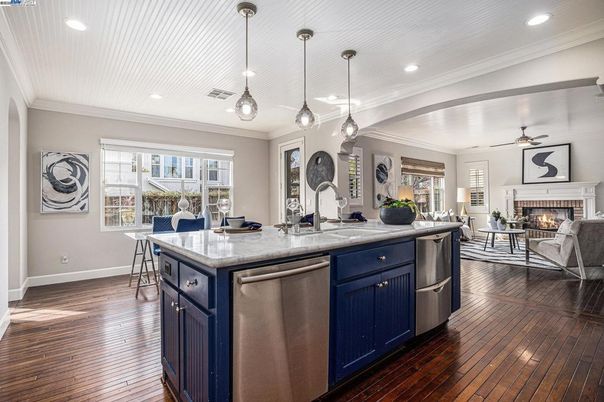Fireplace, Interior, Kitchen, Living room, Pendant Lights, Recessed Lighting, Stainless Steel Appliances, Wood Texture Flooring