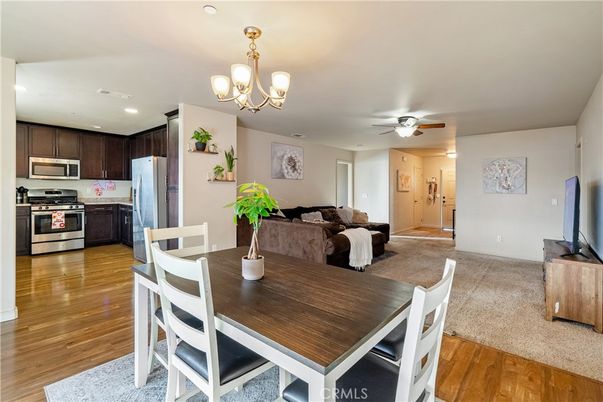 Chandelier, Dining room, Interior, Kitchen, Recessed Lighting, Stainless Steel Appliances, Wood Texture Flooring