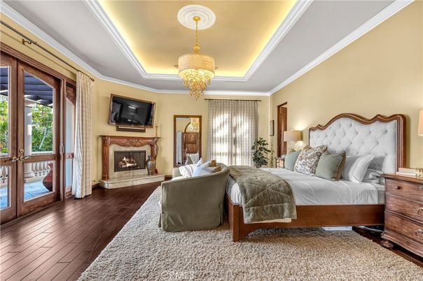 Bedroom, Chandelier, Fireplace, Interior, Wood Texture Flooring