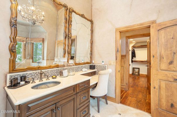 Bathroom, Chandelier, Dual Sink Vanities, Interior, Wood Texture Flooring