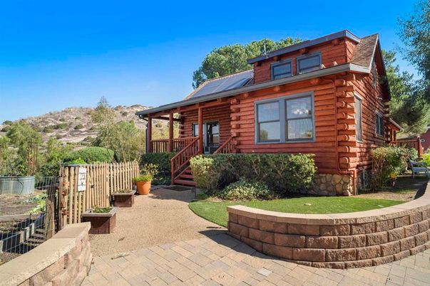 Exterior, Facade, Solar Panels, Log Home