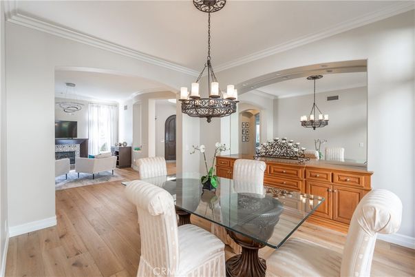 Chandelier, Dining room, Fireplace, Interior, Living room, Pendant Lights, Wood Texture Flooring