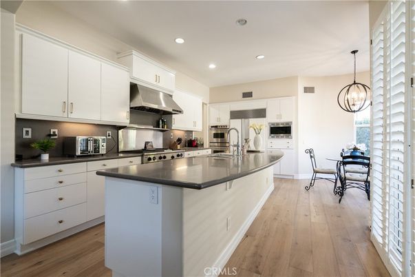 Dining room, Interior, Kitchen, Pendant Lights, Recessed Lighting, Stainless Steel Appliances, Wood Texture Flooring