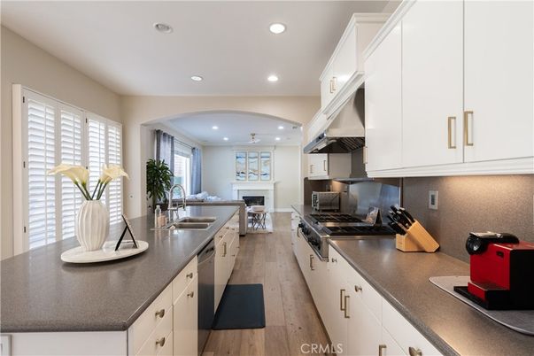 Fireplace, Interior, Kitchen, Recessed Lighting, Stainless Steel Appliances, Wood Texture Flooring
