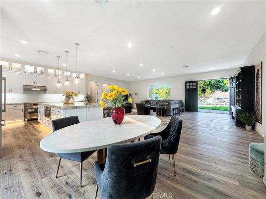 Dining room, Interior, Kitchen, Pendant Lights, Recessed Lighting, Stainless Steel Appliances, Wood Texture Flooring