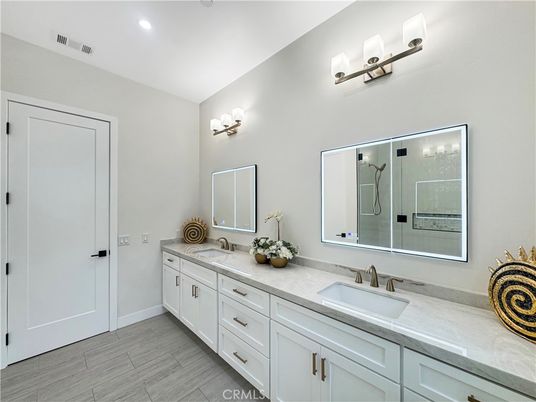 Bathroom, Dual Sink Vanities, Interior, Recessed Lighting, Wood Texture Flooring