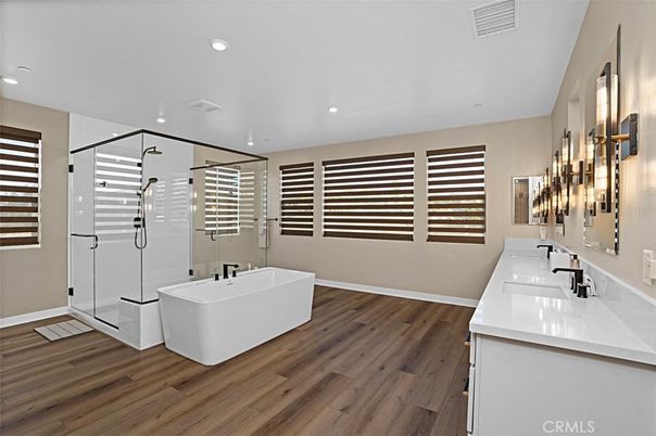 Bathroom, Dual Sink Vanities, Free Standing Baths, Glass Shower, Interior, Recessed Lighting, Wood Texture Flooring